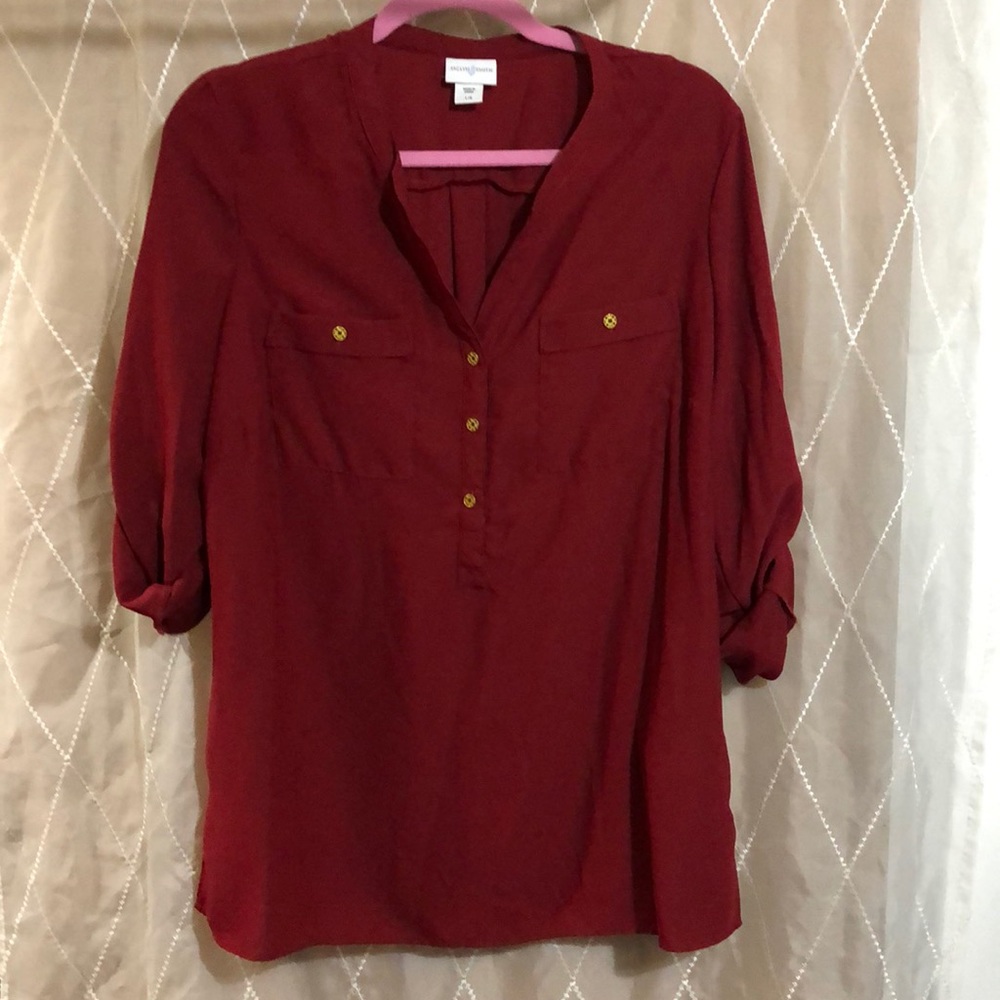 Deep red blouse with roll up sleeve & gold button.